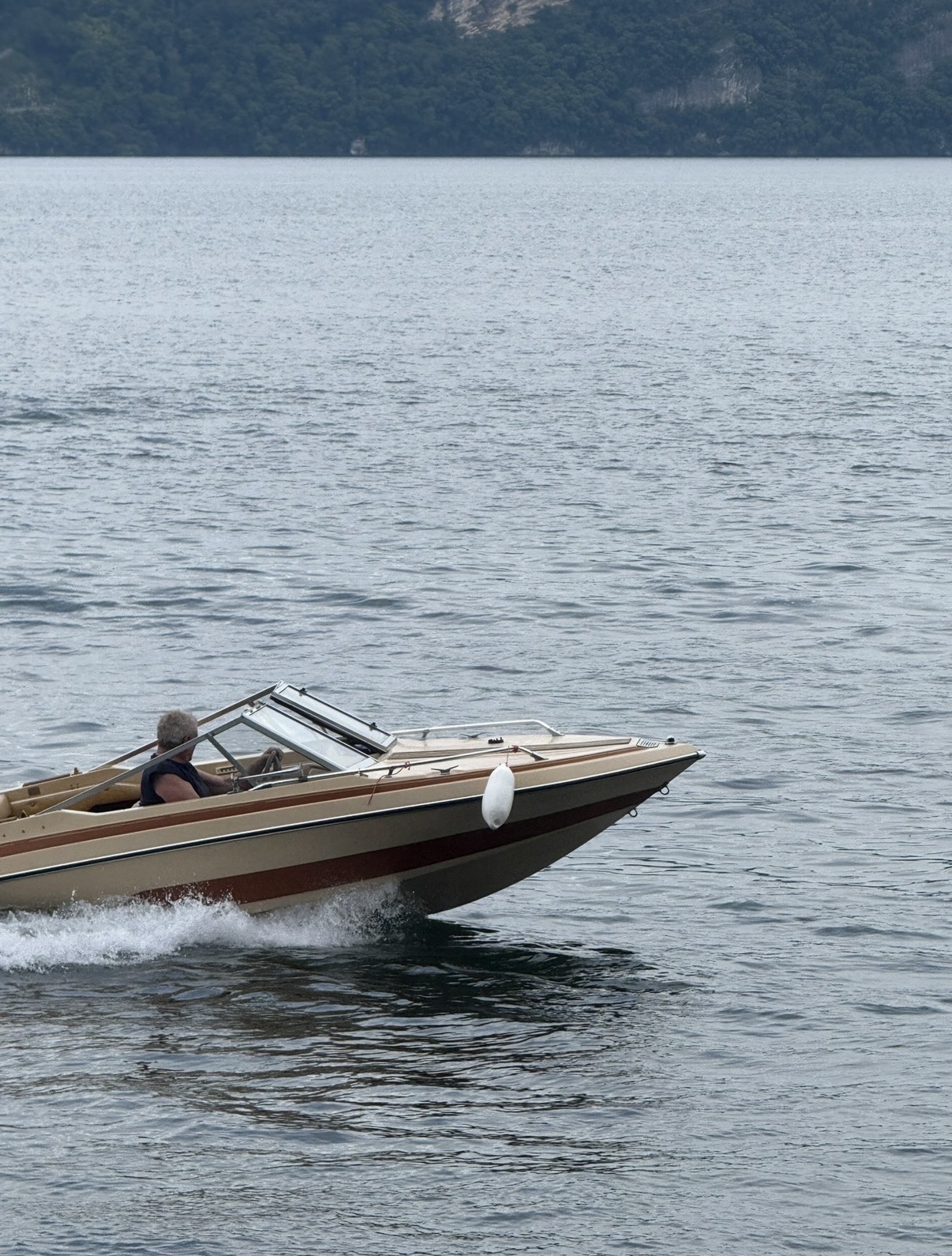 Alexander at the helm, SSV-164 carving across Lake Maggiore